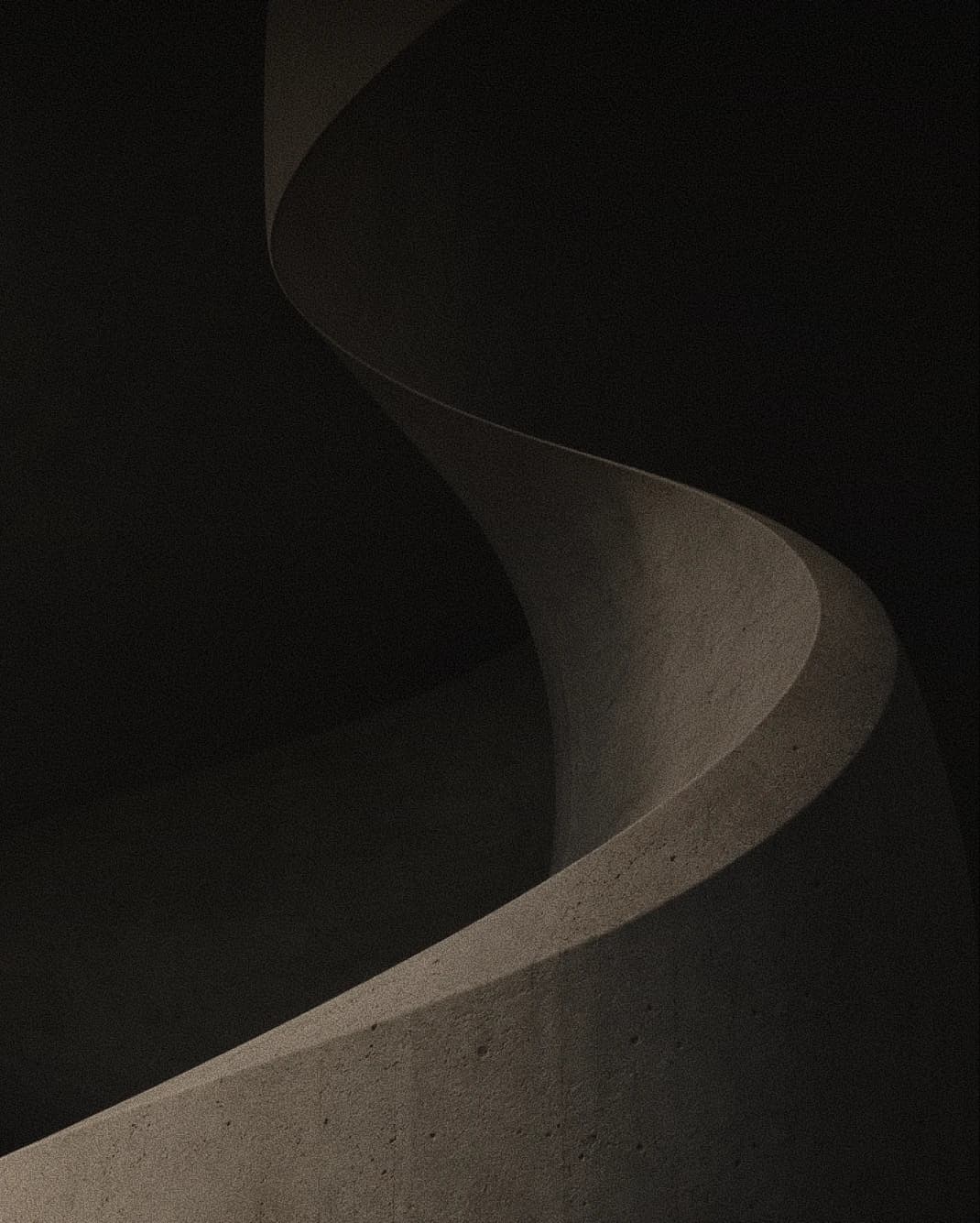 Upward view of curved stone cantilevers against a warm pale sky