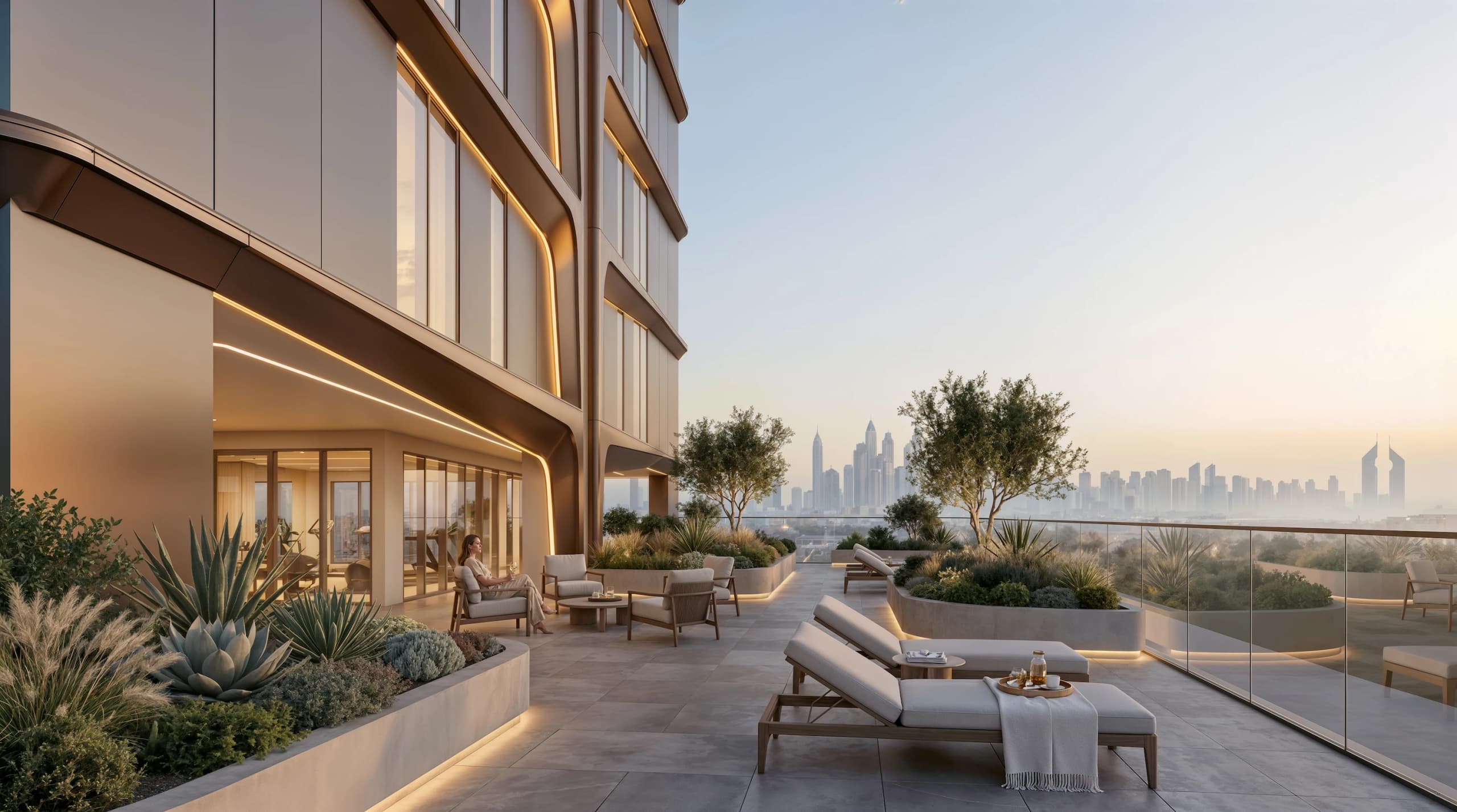 Rooftop terrace with lounge chairs, planters and a view of the Dubai skyline
