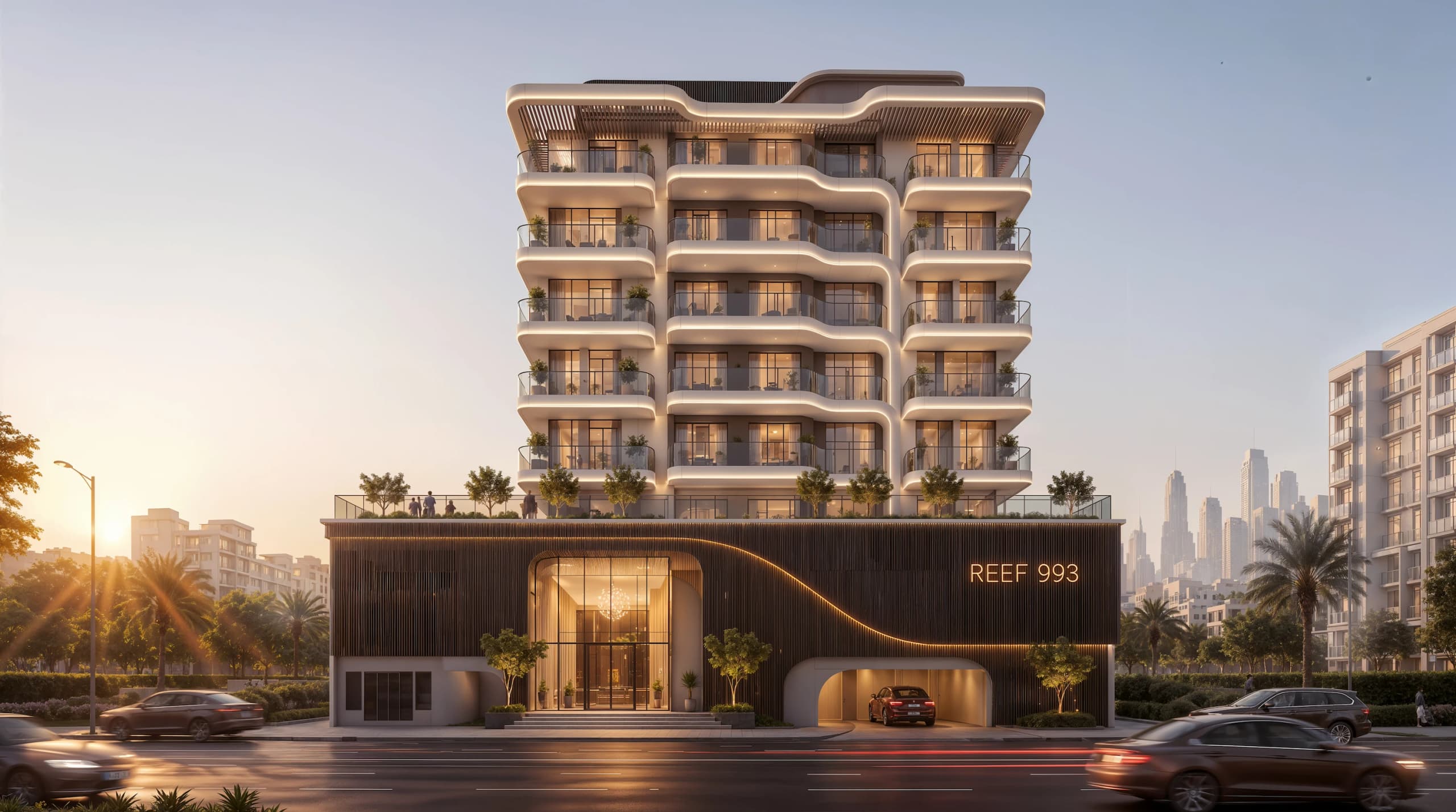 Reef 993: a stepped residential tower above a dark timber podium and entrance at sunset, with the Dubai skyline behind