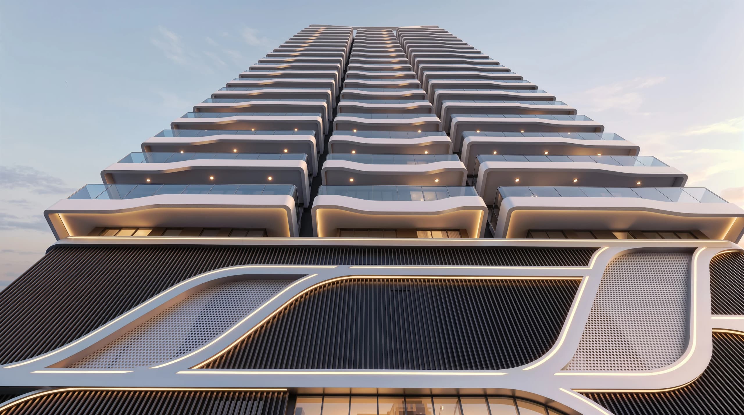 Looking up the tower's rows of stepped balconies above the curved white and dark podium